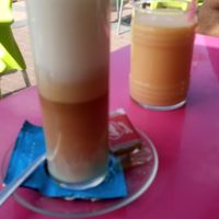 Latte with soy milk and fruit smoothie with seasonal fruit  at Gelatomania in Gran Canaria
