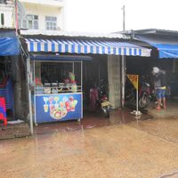 Current (12/10/2017) front of Kuadin restaurant with yellow 'chay' sign on right just before entrance to motorcycle parking area at Khouadin Vegetarian in Vientiane