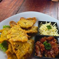 Patacones con hogao are vegan. The cheese was for my goddaughter who isn't vegan. at Lazy Cat in Minca