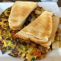 Vegan Omelette with vegan cheese, toast and house potatoes  at My Diner in Melrose