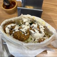Falafel pita with spicy sauce on the sidee  at Pita Bakery in Central Singapore