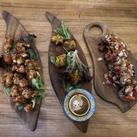 Cauliflower bites, kimchi dumplings and bruschetta   at Elixiba in Byron Bay