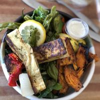 Base of greens, tofu, shishido peppers, sweet potatoes, and roasted veggies  at DIG in Rye Brook