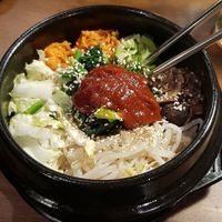 Vegatable bibimbap in hot stone bowl and guchujang at Bibimcup in Dusseldorf