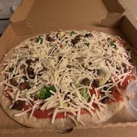 Take-and-bake vegetazione vegan pizza! We froze it and baked at home per instructions, and it was incredible !  at Baba Louie's Sourdough Pizza in Great Barrington