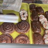 There too two trays are All Vegan Donuts.Cinnamon bear,crawl sprinkle doughnut,chocolate doughnut, cinnamon bear claw with chocolate swirl  at Donut Xpress in Ontario