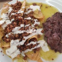 Chilaquiles verdes con suadero servidos en el desayuno at VEGuerrero in Mexico City