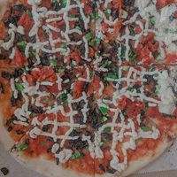 vegan pizza with actual burnt mushrooms and the cheese looked like poop ngl 1/10 at The Tomato Shack Salad & Pizza co in West Chester