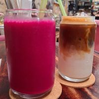 Pink smoothie & iced latte with oat milk at Lazy Cats  in Ubud