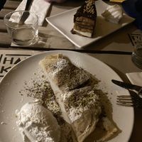 (Front) crepes with hazelnut filling, (back) creamy chocolate cake   at Haiku in Palermo