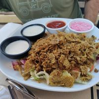 Kebab with a creamy sauce, garlic sauce, spicy sauce, and ginger sauce at Haiku in Palermo