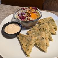Farinata with hummus and salad at Haiku in Palermo