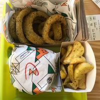 Burger, wedges and onion rings! :) at La Trocadero in Barcelona