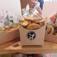 Hot dog, potato wedges and onion rings at La Trocadero in Barcelona