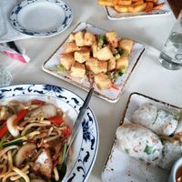 Fried noodles with chick*n, salt and pepper tofu, summer rolls and chips at Saigon68 in Sheffield