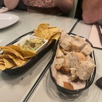 Guacamole and chips and bread with vegan cheese  at Organi Chiado in Lisbon