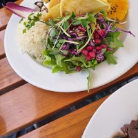 Burgerpatty with chips, rice and salad at Organi Chiado in Lisbon