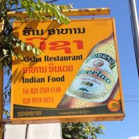 Sign on street at Nisha Restaurant  in Phonsavan