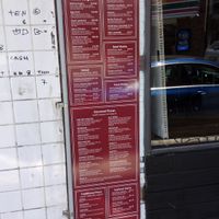 Menu with animal parts and secretions! at Mr Natural Vegetarian Pizza in St Kilda
