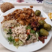 Lasagna, lemon brussel sprouts, salad with delicious tamari sauce at Kasvis Ravintola  in Turku