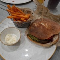 Veg burger with sweet potato fries and vegan mayo at Al Lampione in Gorizia