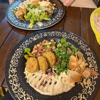Menu 1 & 2: falafel, humous, fava beans and chickpea, tabbouleh (closest), baba ganoush and salad (furthest). Comes with bread on the side  at Falafel Koy in Istanbul