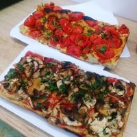 mushroom pizza and spicy cherry tomato pizza at Romana Pizza in Lisbon