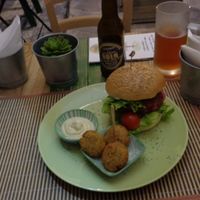 Beet veggie burger with falafel and beer. at JustVeggie in Siracusa