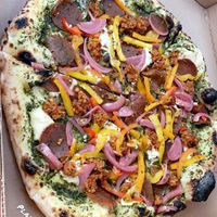 Pesto pizza with pepperoni, sausage, onions & peppers!   at Floralia in Honolulu