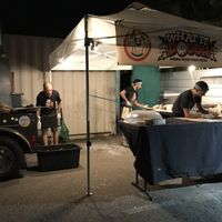 The tent and mobile wood stove where you order and they make the pizza at Floralia in Honolulu