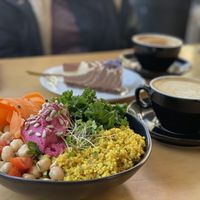 Buddha bowl, latte coffee and zebra cake  at The Vegan Fairies in Nea Erythraia