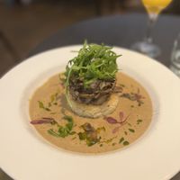 Wild Mushroom Risotto Cake
topped with seasonal wild mushrooms, creamy cep sauce, rocket & lemon truffle dressing  at The Gate - Marylebone in London