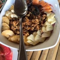 Energy fruit bowl. Delish granola papaya pineapple dates dragon fruit.  I’ll be dreaming about this one when we leave. So good  at Green Leaf Cafe in Jemuluk