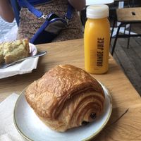 Pain au chocolate and OJ.  at The Fields Beneath - Kentish Town in North West London