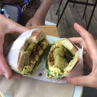 Bagel with pickles, scrambled tofu, tofu bacon and spinach (£8.40).  at The Fields Beneath - Kentish Town in North West London