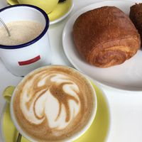 Chocolate croissant and lattes at The Fields Beneath - Kentish Town in North West London