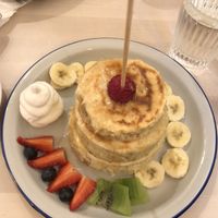 Pancakes with fruit and vegan cream.  at Chillin' Cafe in Madrid