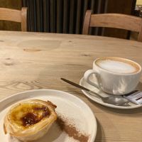 Oatmilk cappuccino and pastel de nata at Le Pain Quotidien in Leuven