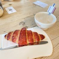 Hibiscus croissant + oat milk latte  at Le Pain Quotidien - Kievitplein in Antwerpen