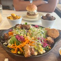 Power Salad with carrot dressing and extra tofu nuggets, sake kasu burger, fried herb potatoes, and soy meat  at Fluunt KOFU in Kofu