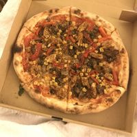 Build your own pizza (with vegan BBQ chicken, peppers, corn, and mushrooms) at Firecrust in Vancouver
