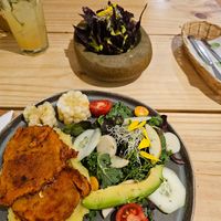 Vegan steak, mashed potatoes and salad. Guacamole in the background. at Vida Vegan Bistro in Cusco