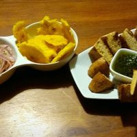 Garlic bread and patacones.  at Vida Vegan Bistro in Cusco