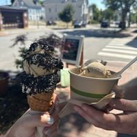 Pistachio double scoop on a waffle cone and a dish of coffee + strawberry cheesecake   at Sticky Sweet in Portland