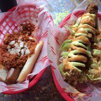 Half eaten chilli dog and Kentucky fried doggo.  at Larder in Brighton