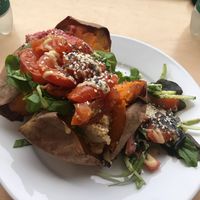 Hummus and roast tomato baked sweet potato at Larder in Brighton
