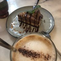 Raw cake and Oat Milk Coffee at Pura in Luzern