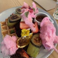 Waffles with bananas, chocolate soil, mixed berries and candy floss! at Comes and Goes in Lower Hutt