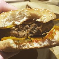 Close up of the double cheese 1/4lb burger ?  at Earth Restaurant & Takeaway in Petersfield