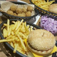 Big earth burger, fries, popcorn chicken and coleslaw at Earth Restaurant & Takeaway in Petersfield